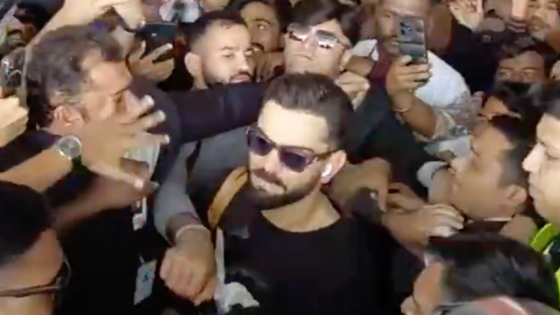 Fans-Mobbed-Virat-Kohli-At-Vadodara-Airport